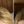 Before and after image of a person with straight blonde hair and thin hair on their parting line