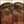 Before and after image of a woman with straight reddish-brown hair and thin hair on her crown