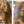 Before and after image of a woman with long straight dark blonde hair with thin hair around her crown
